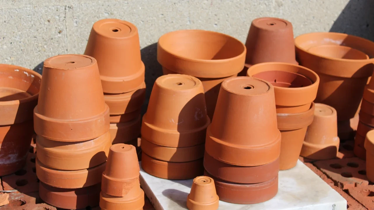Terracotta and clay pots are porous, permitting air and water flow through the walls. This provides more breathability for under-soil plant roots compared to solid plastic containers